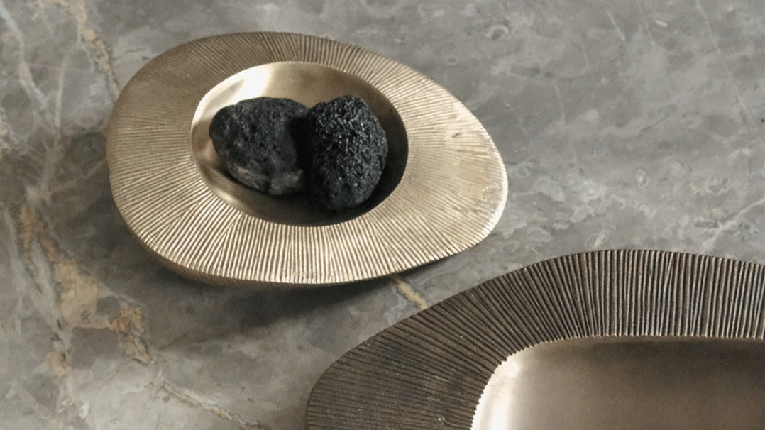 BRANDT Collective bowls and trays in marble, burnished brass, sating brass and aluminium.