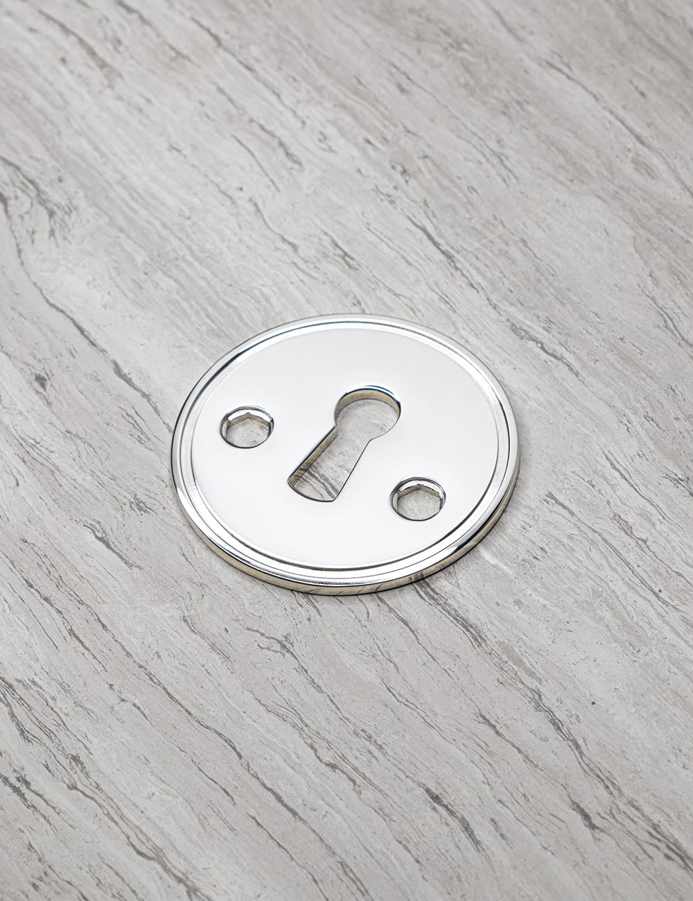 CHISEL keyhole in Polished Nickel. Luxury door hardware by BRANDT Collective.