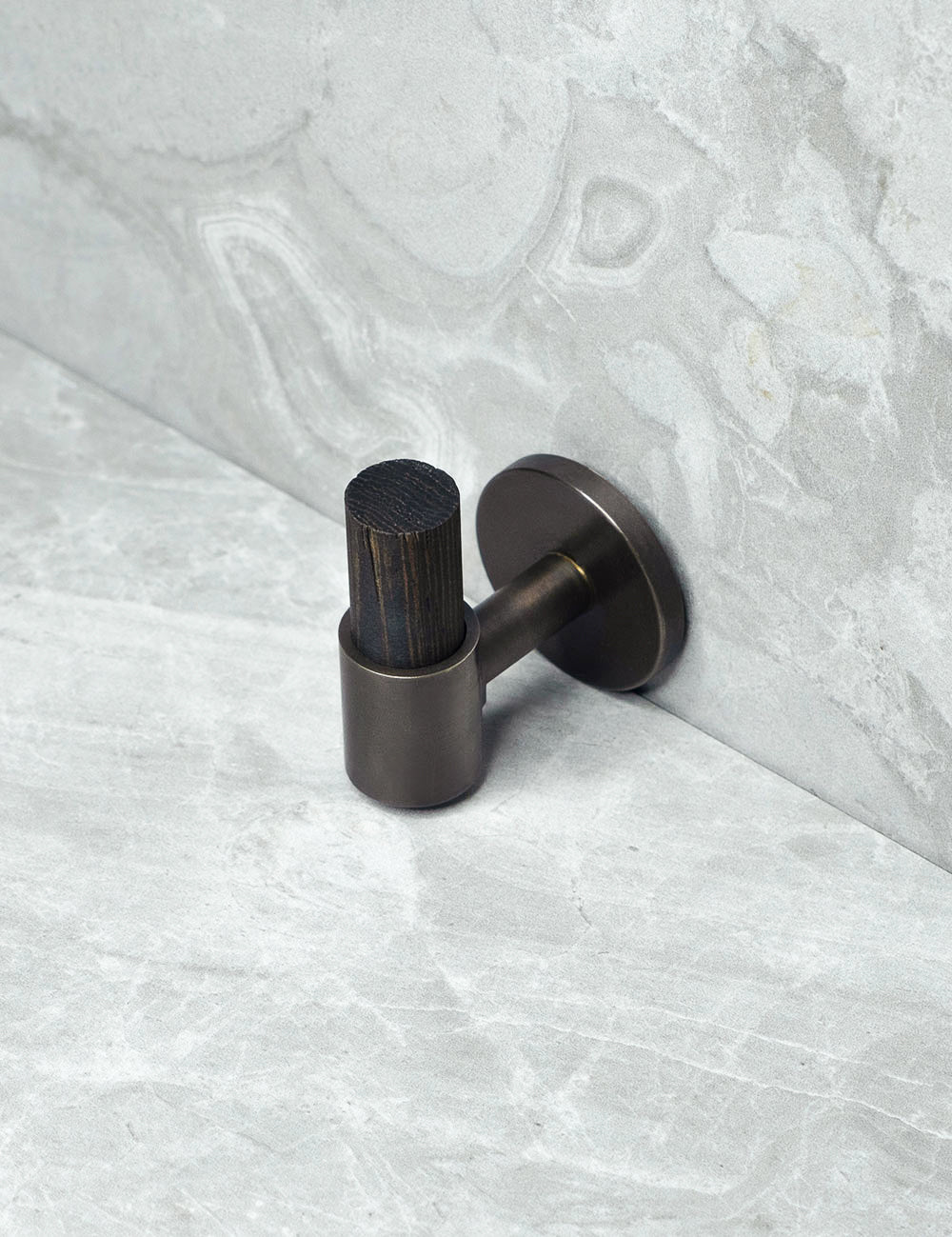 SIGNATURE 30 END knob in Burnished Brass/Wenge. Luxury cabinet hardware made of solid brass by BRANDT Collective.