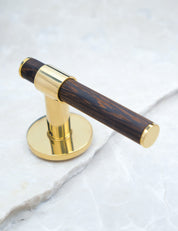  END door handle in Polished Brass/Wenge. Luxury door hardware made of solid brass by BRANDT Collective.