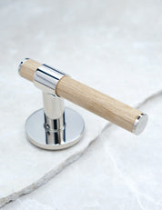 END door handle in Polished Nickel/Oak. Luxury door hardware made of solid brass by BRANDT Collective.