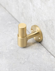 SIGNATURE hook in Brushed Brass/Brushed Brass. Luxury hardware made of solid brass by BRANDT Collective.