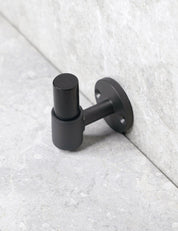 SIGNATURE hook in Nearly Black/Black Horn. Luxury hardware made of solid brass by BRANDT Collective. 