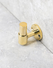 SIGNATURE hook in Polished Brass/Polished Brass. Luxury hardware made of solid brass by BRANDT Collective.