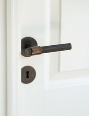 END door handle in Burnished Brass/Wenge. Luxury door hardware made of solid brass by BRANDT Collective.