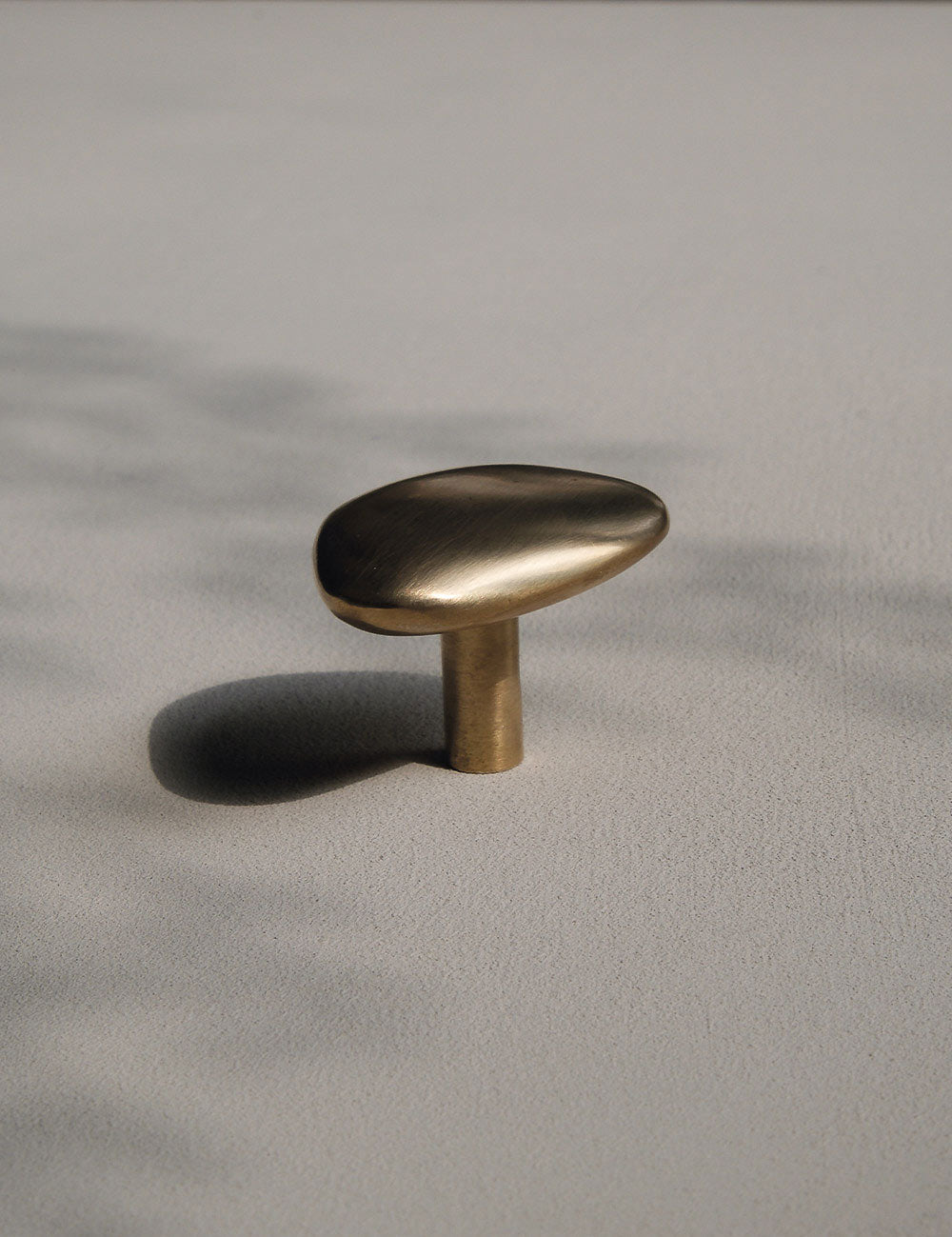 NOBLE knob in satin brass made of solid brass designed by Julie Brandt for BRANDT Collective