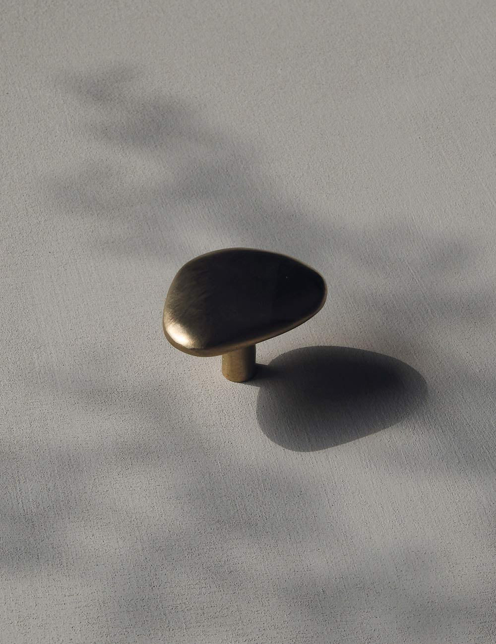 NOBLE knob in satin brass made of solid brass designed by Julie Brandt for BRANDT Collective