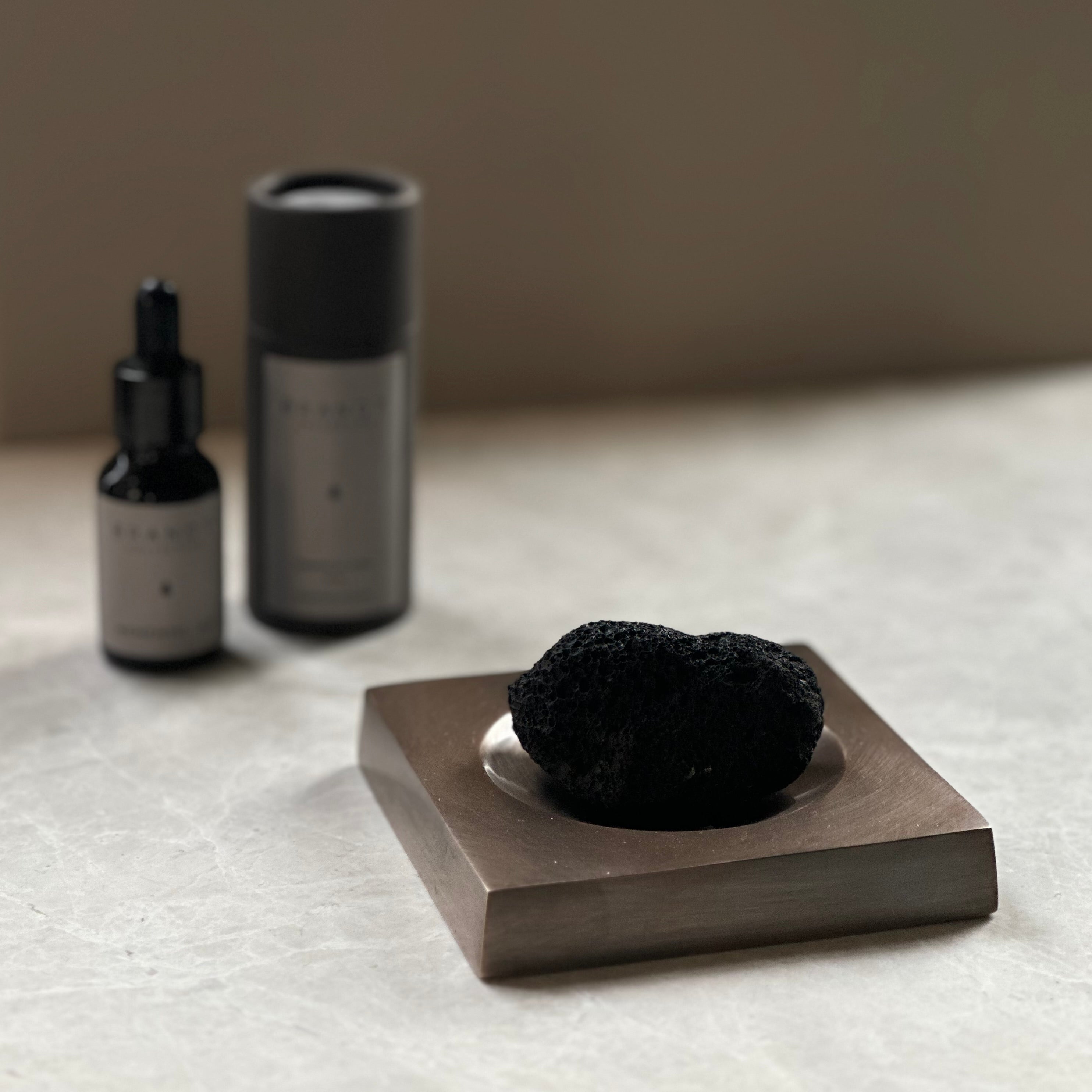 PLATEAU fragrance tray set in Burnished Brass, lava rock and oil. Designed by Julie Brandt for BRANDT Collective