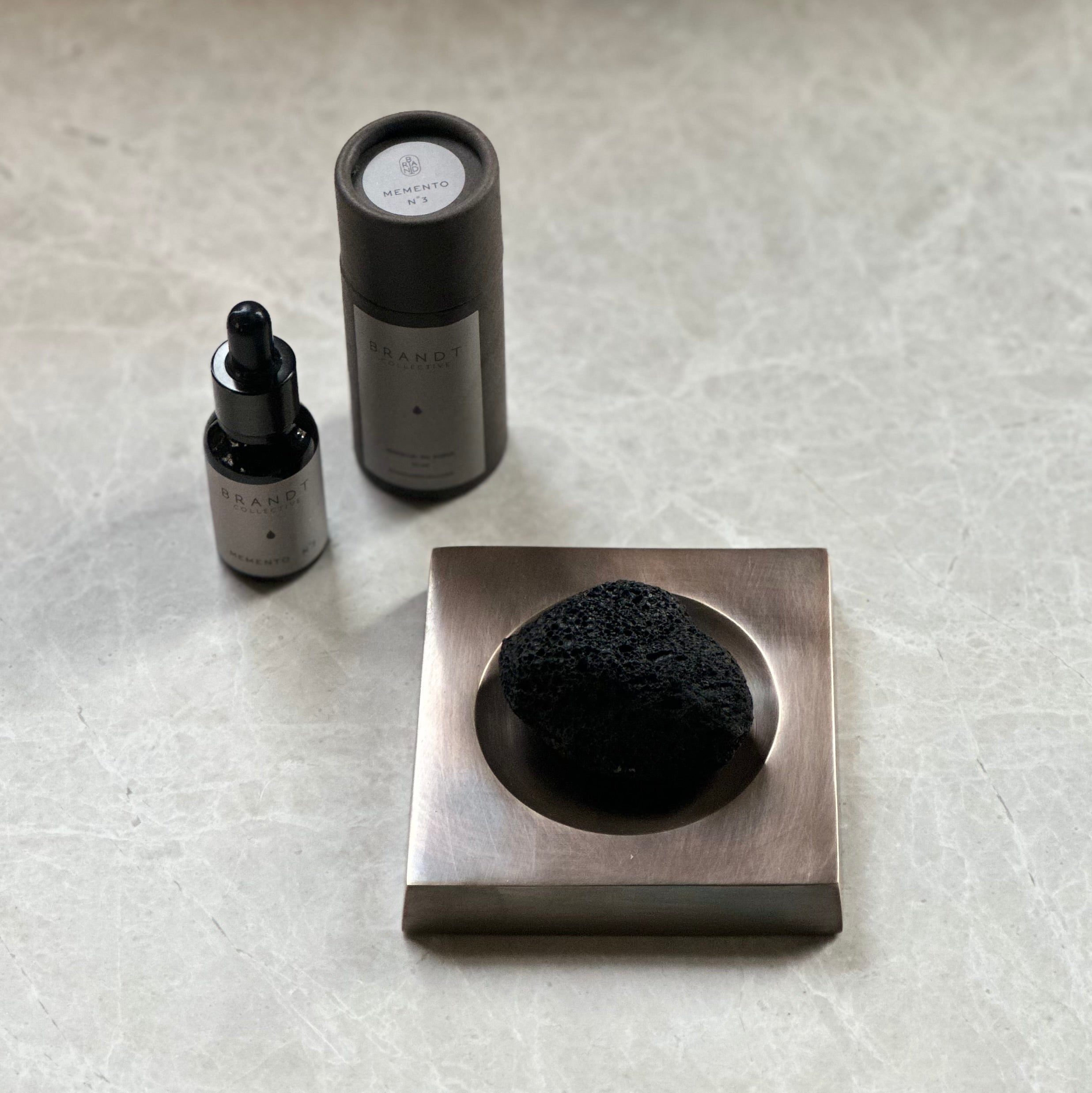 PLATEAU fragrance tray set in Burnished Brass, lava rock and oil. Designed by Julie Brandt for BRANDT Collective