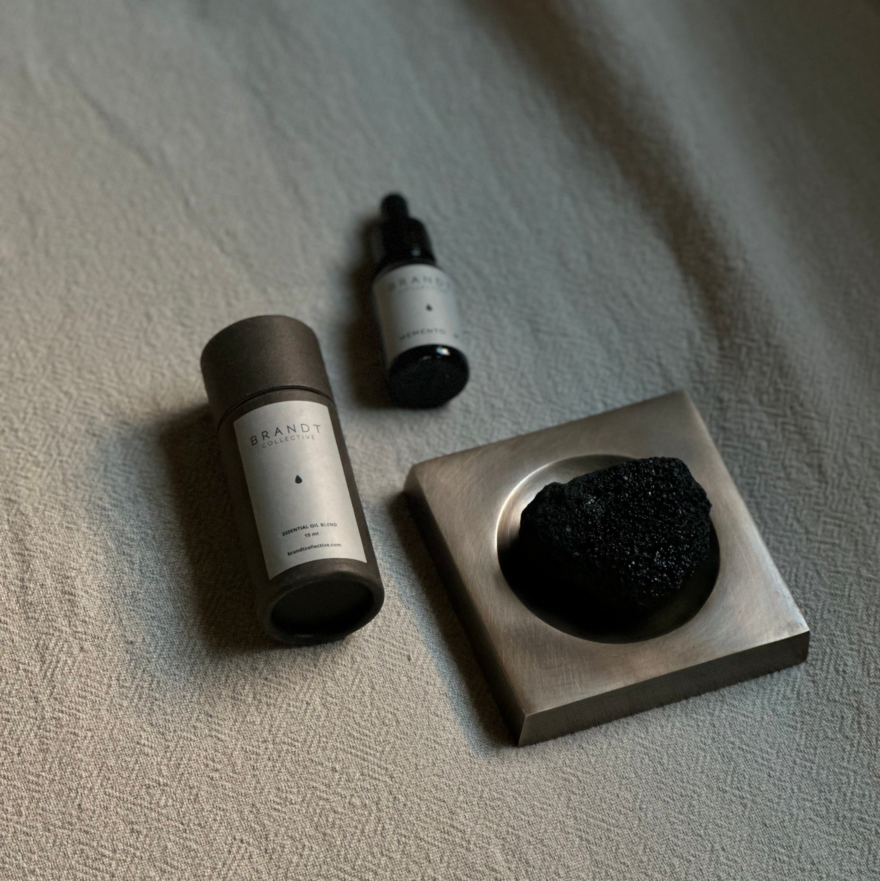 PLATEAU fragrance tray set in Burnished Brass, lava rock and oil. Designed by Julie Brandt for BRANDT Collective