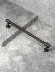 SIGNATURE slim END pull bar 186 mm in Nearly Black/Wenge. Modern cabinet hardware made of solid brass by BRANDT Collective.