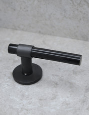 SIGNATURE door handle in Nearly Black/Black Horn. Modern door hardware made of solid brass by BRANDT Collective.