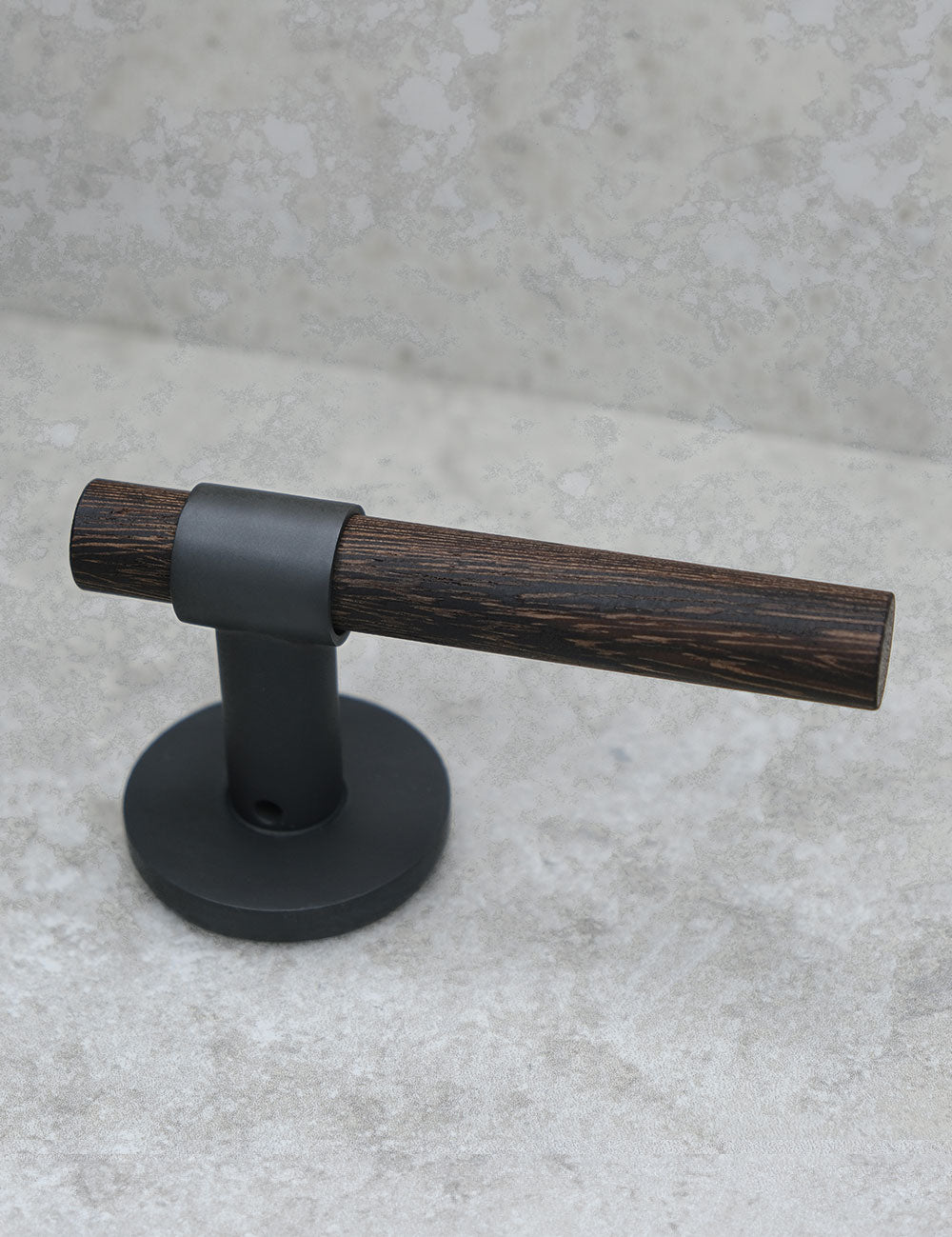 SIGNATURE door handle in Nearly Black/Wenge. Modern door hardware made of solid brass by BRANDT Collective.