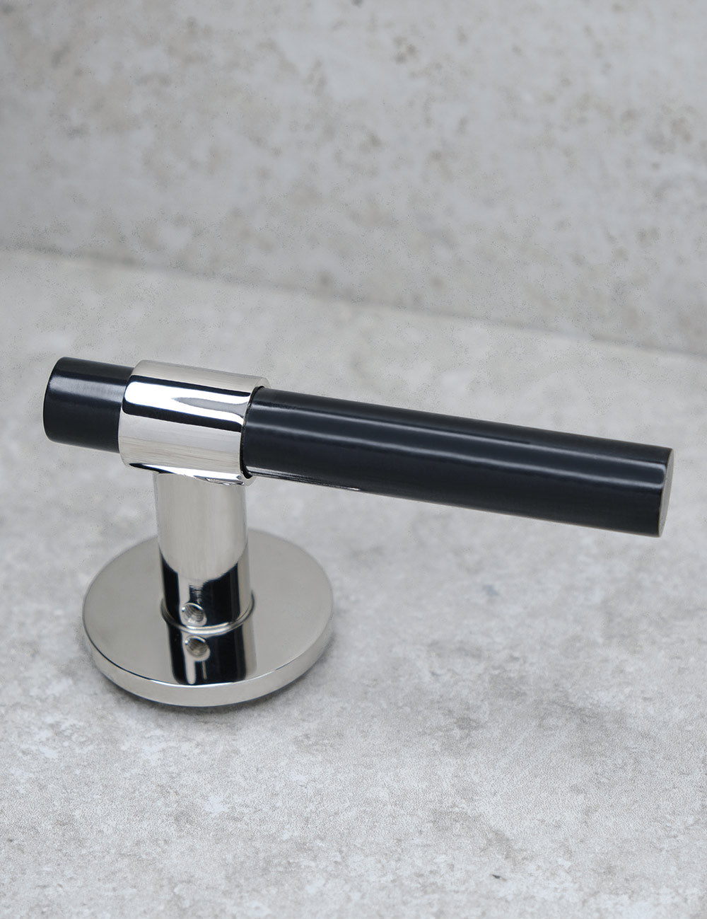 SIGNATURE door handle in Polished Nickel/Black Horn. Modern door hardware made of solid brass by BRANDT Collective.