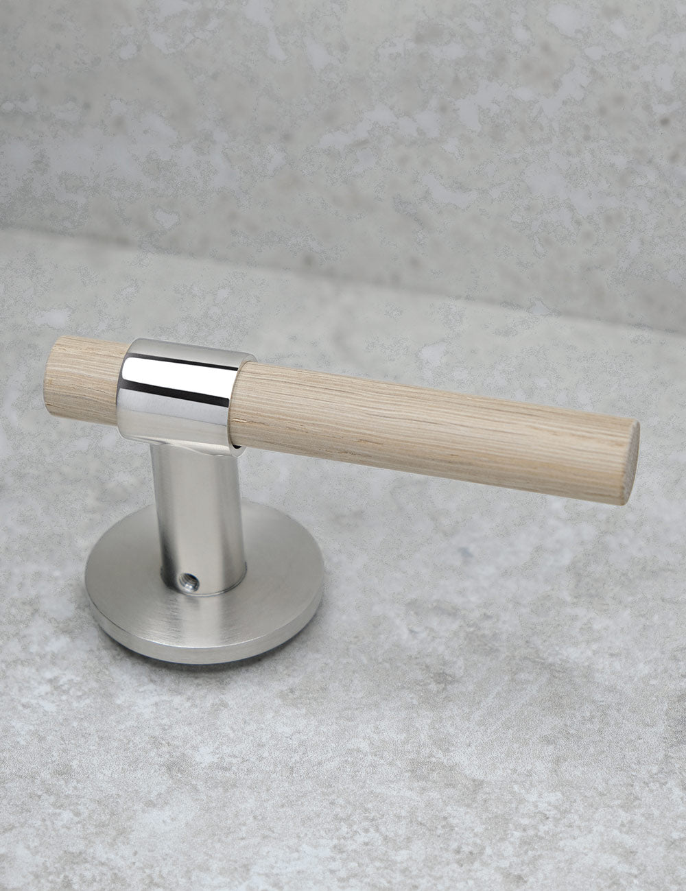 SIGNATURE door handle in Polished Nickel/Oak. Modern door hardware made of solid brass by BRANDT Collective.