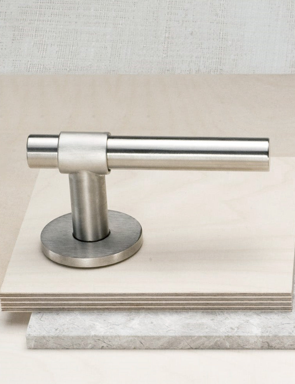 SIGNATURE door handle in Brushed Nickel/Brushed Nickel. Modern door hardware made of solid brass by BRANDT Collective.