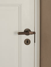 SIGNATURE door handle in Burnished Brass/Burnished Brass. Modern door hardware made of solid brass by BRANDT Collective.