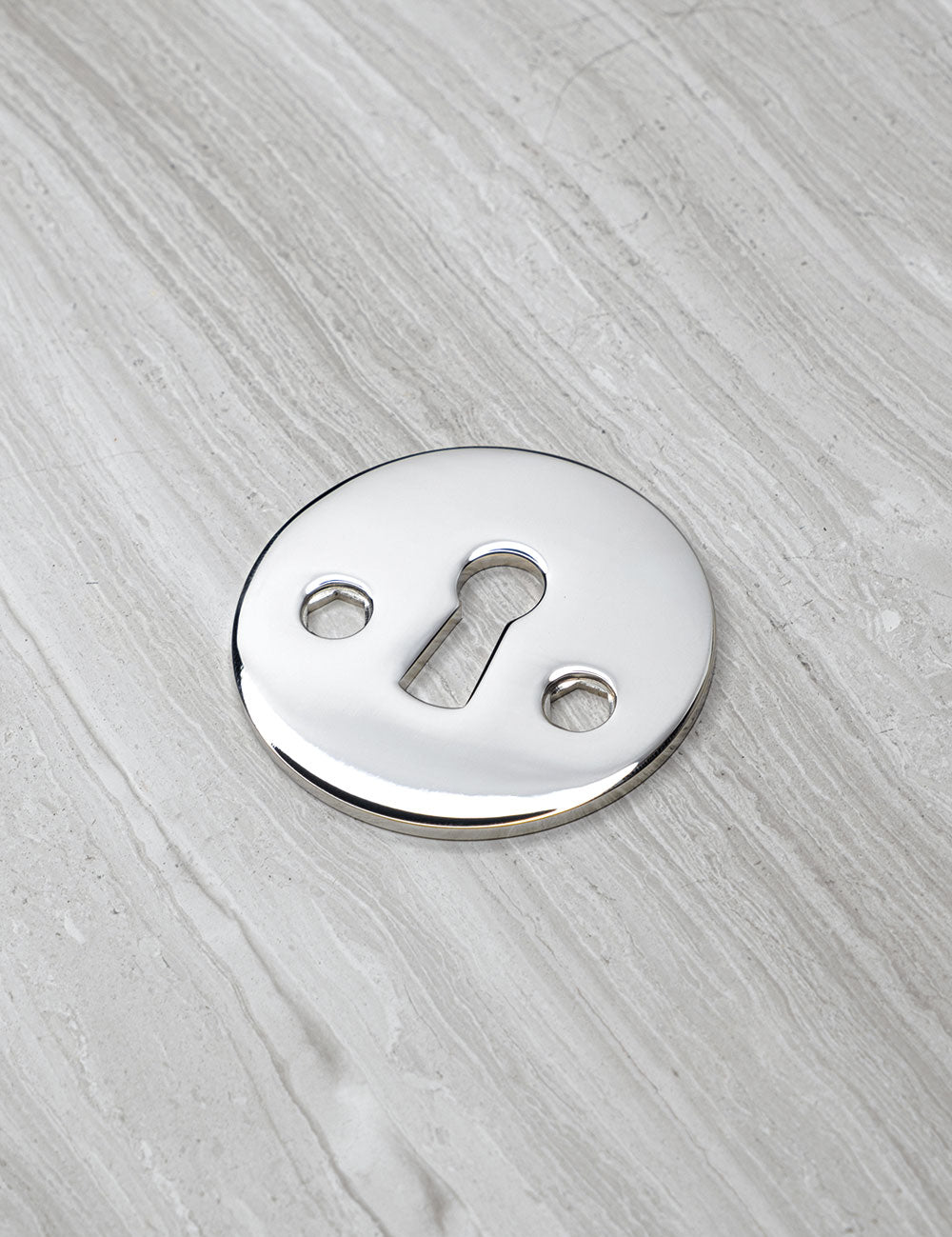 SIGNATURE keyhole in Polished Nickel. Luxury door hardware by BRANDT Collective.