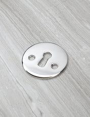 SIGNATURE keyhole in Polished Nickel. Luxury door hardware by BRANDT Collective.