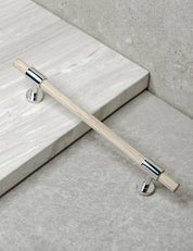Cabinet handle SIGNATURE slim pull bar 182 mm in Polished Nickel / Oak. Modern cabinet hardware made of solid brass by BRANDT Copenhagen.