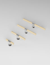 SIGNATURE 20 T-bar handle 113 mm in Polished Nickel/Oak. Luxury cabinet hardware made of solid brass by BRANDT Collective. 