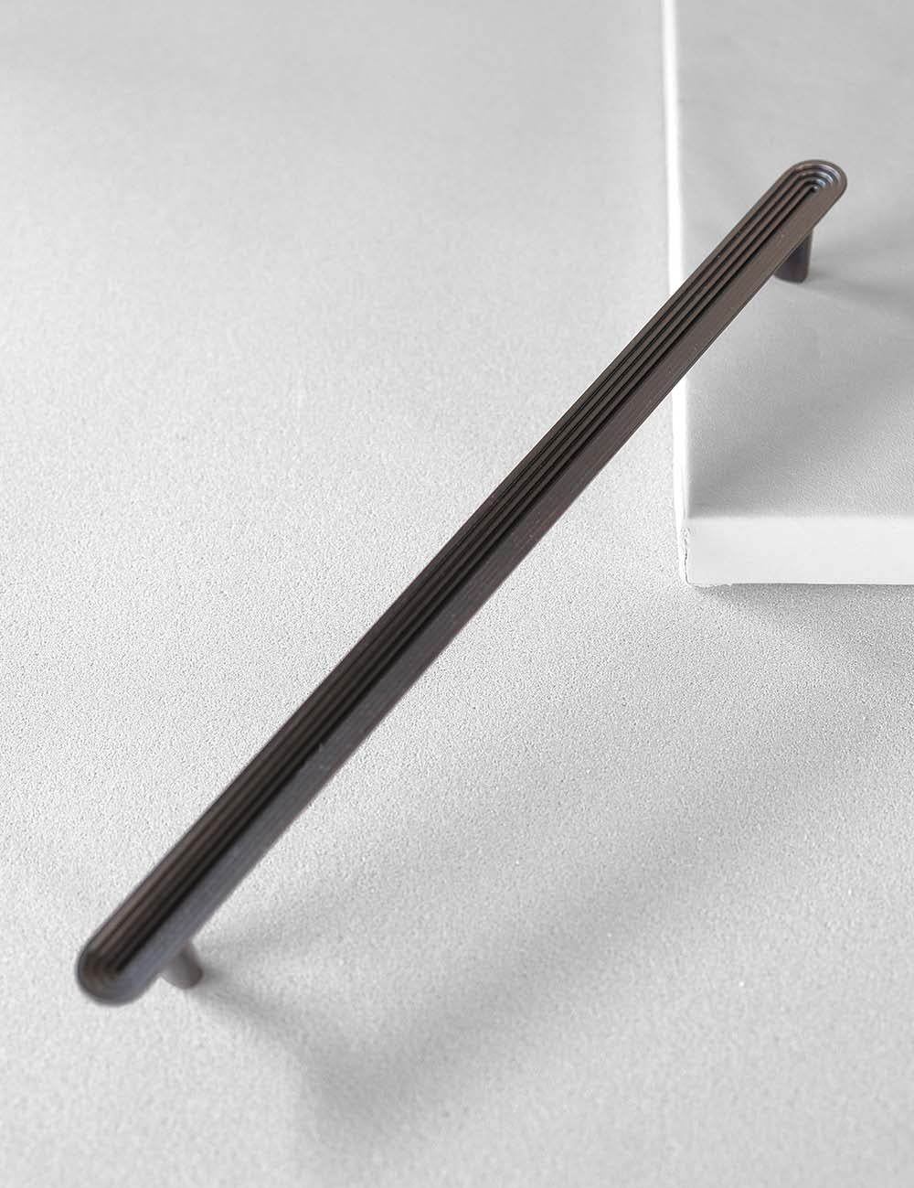 TERRACE pull bar 300 mm in Gunmetal by BRANDT Collective. A hardware collection in collab with Norm architects consisting of knobs, T-bars and pull bars.