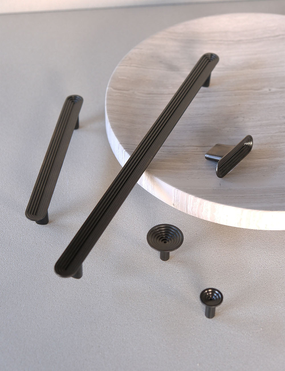 TERRACE collection in Gunmetal by BRANDT Collective. A hardware collection in collab with Norm architects consisting of knobs, T-bars and pull bars.