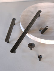 TERRACE collection in Gunmetal by BRANDT Collective. A hardware collection in collab with Norm architects consisting of knobs, T-bars and pull bars.