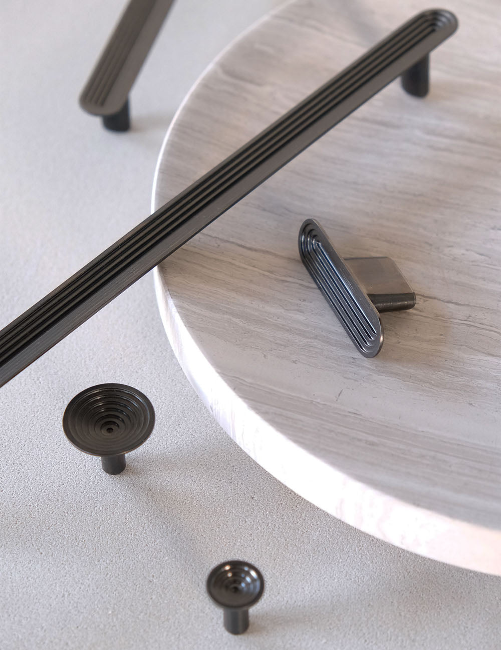 TERRACE collection in Gunmetal by BRANDT Collective. A hardware collection in collab with Norm architects consisting of knobs, T-bars and pull bars.