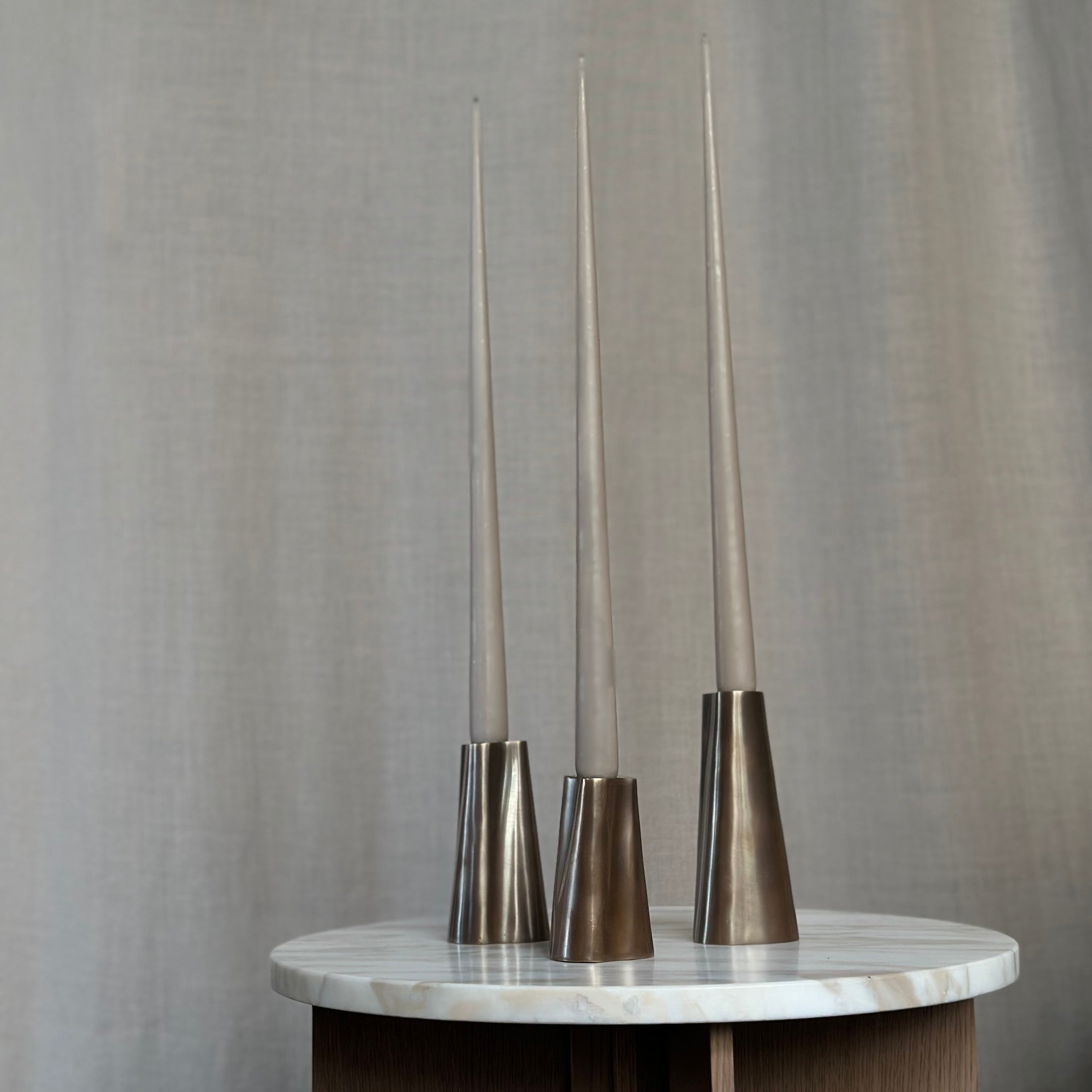 TRUNK candleholder in burnished brass. Designed by Julie Brandt for BRANDT Collective