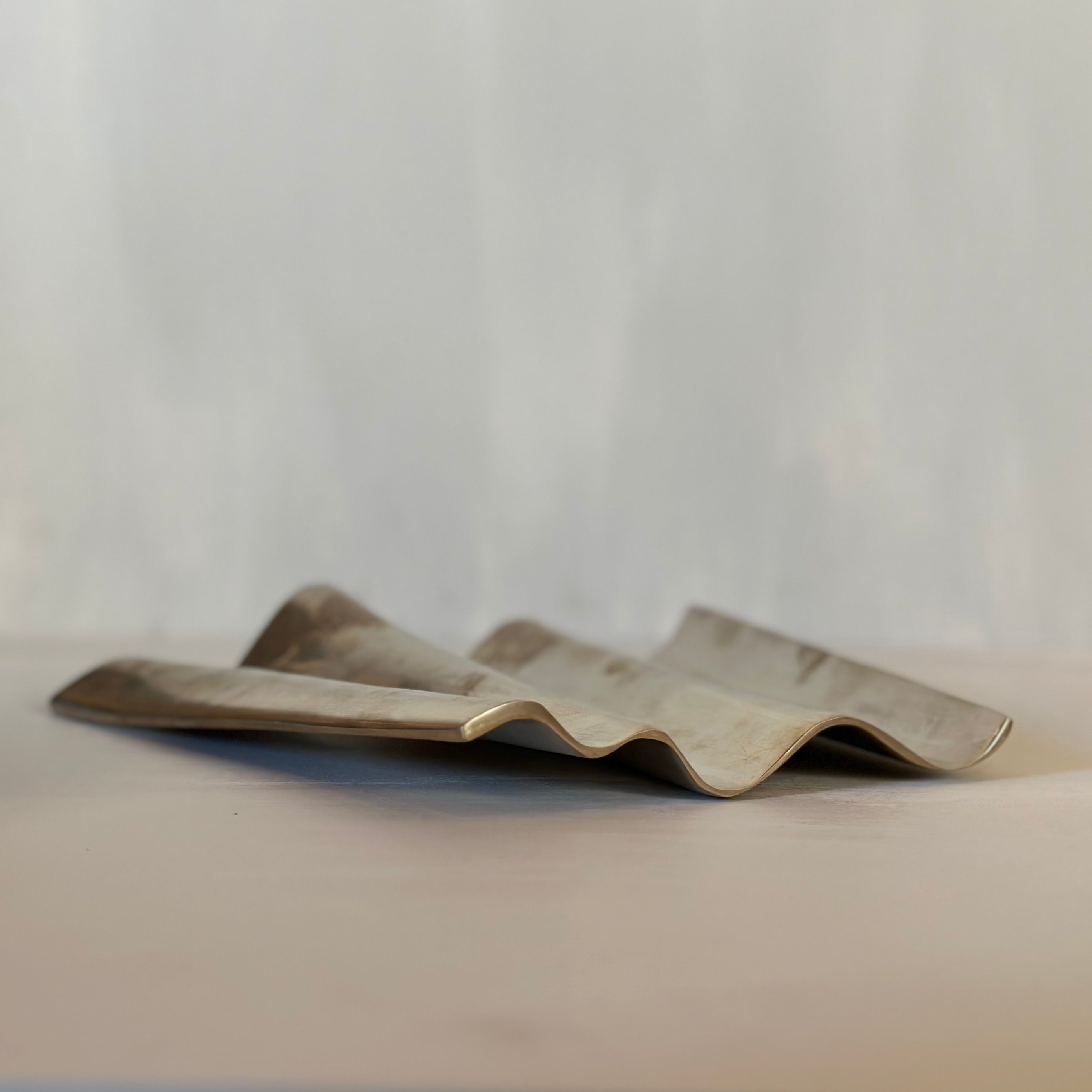 WALL sculpture in burninshed brass is designed by Julie Brandt for BRANDT Collective.