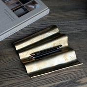 WALL sculpture in satin brass is designed by Julie Brandt for BRANDT Collective.