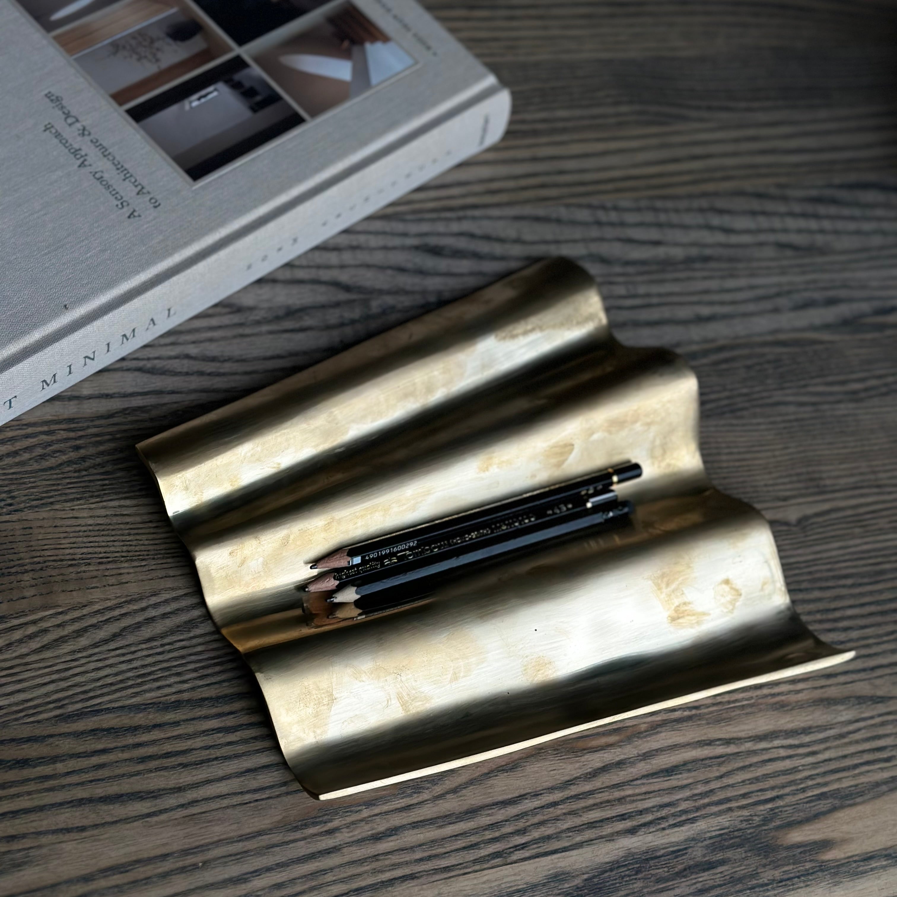 WALL sculpture in satin brass is designed by Julie Brandt for BRANDT Collective.