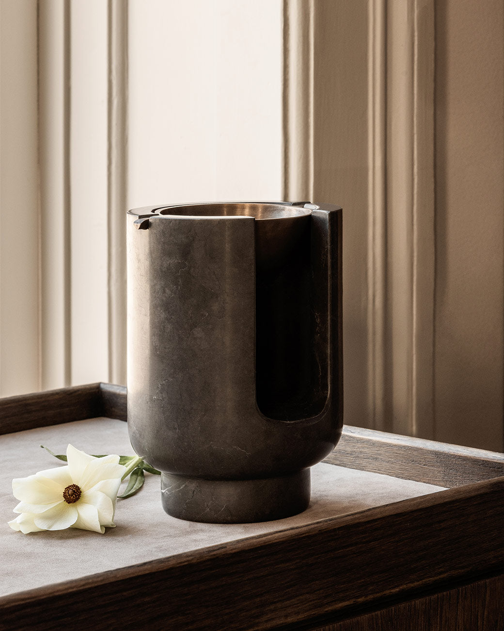 AURA Oil Burner diffuser from BRANDT Copenhagen with a marble base in Riyal Grey and metal top in satin brass