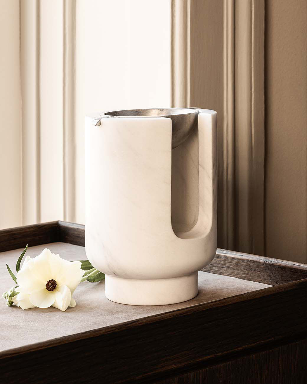 AURA oil burner diffuser set in snow white marbel with a metal top i satin aluminum. Designed by Julie Brandt for BRANDT Copenhagen