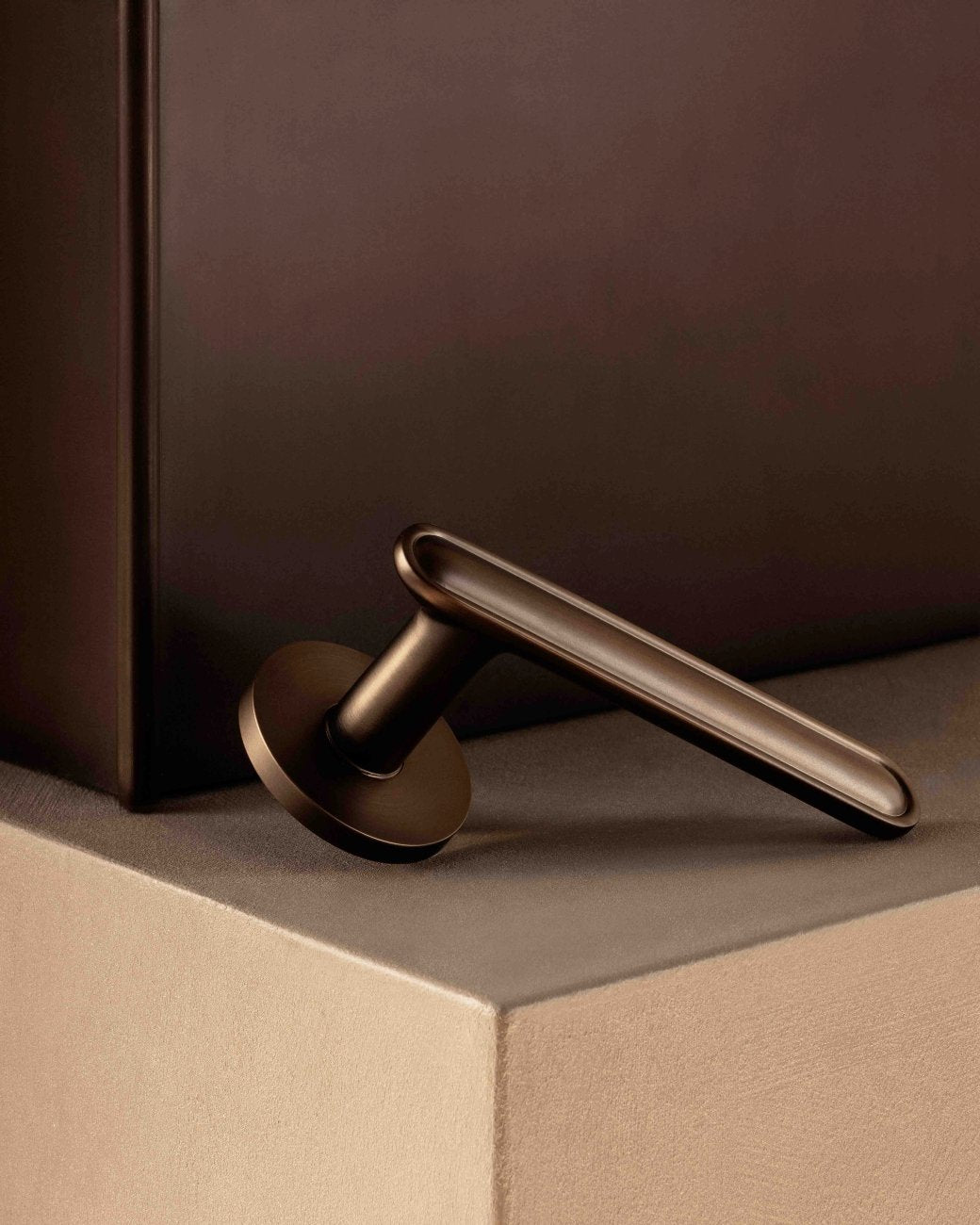 BUTTON door handles set in Burnished Brass from BRANDT Copenhagen. Designed in collab with Norm architects.