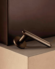 BUTTON door handles set in Burnished Brass from BRANDT Copenhagen. Designed in collab with Norm architects.