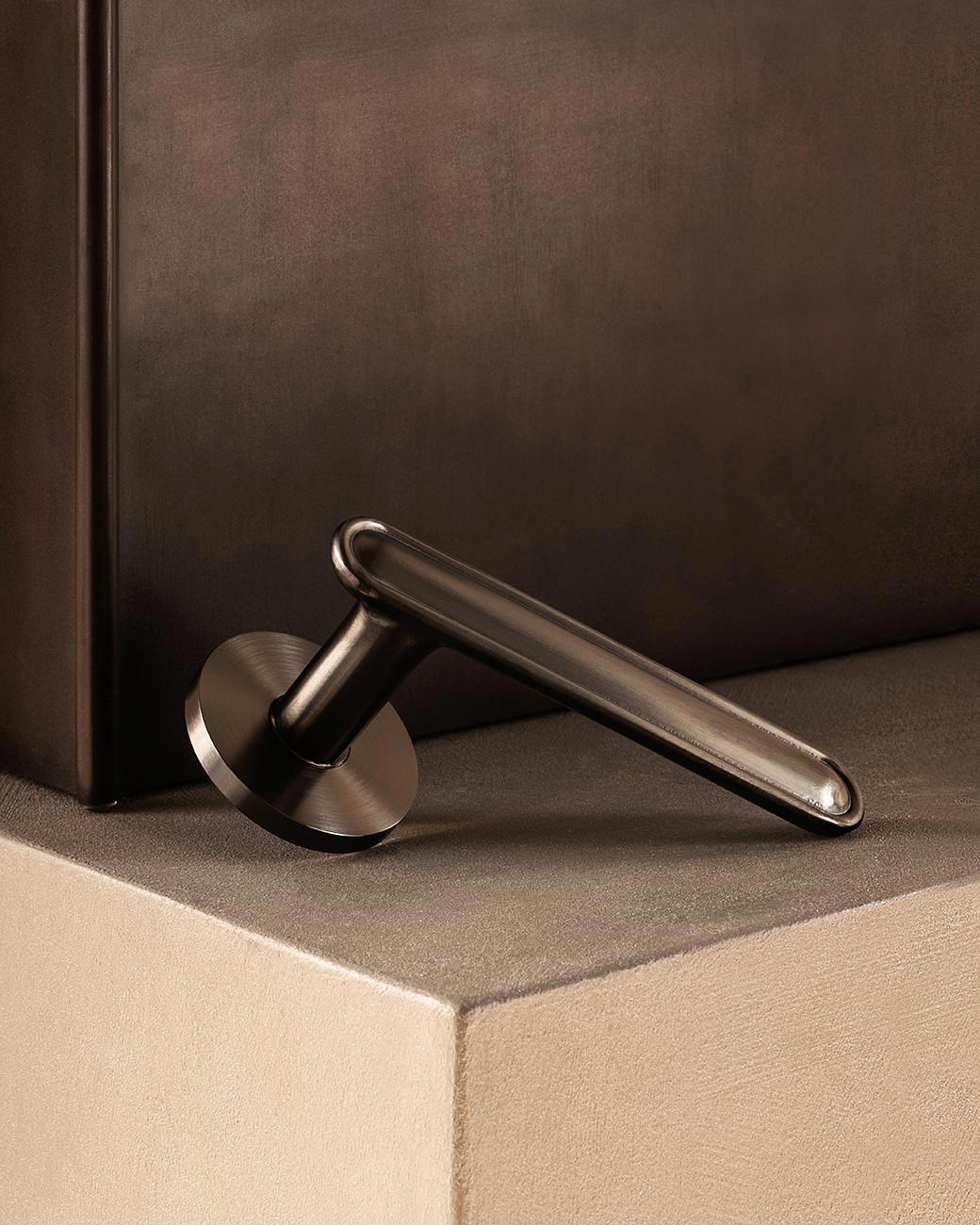 BUTTON door handle set in Gunmetal by BRANDT Copenhagen. Designed in collab with Norm Architects.