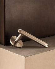 BUTTON door handle set in Satin Nickel by BTANDT Copenhagen. Designed in collab with Norm architects.
