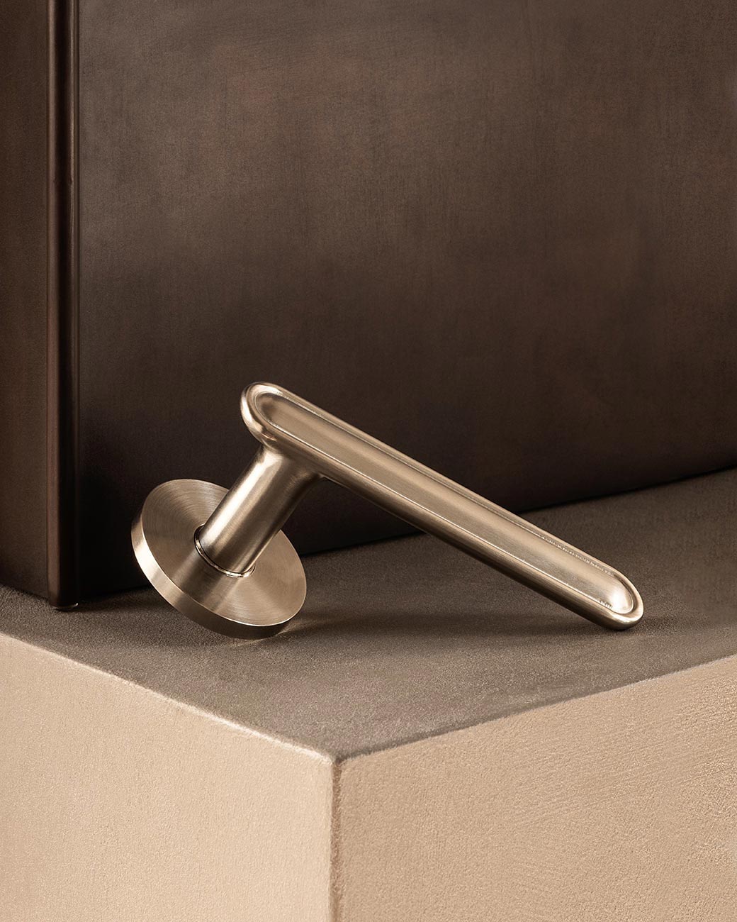 BUTTON door handle set in Satin Nickel by BRANDT Copenhagen. Designed in collab with Norm architects.