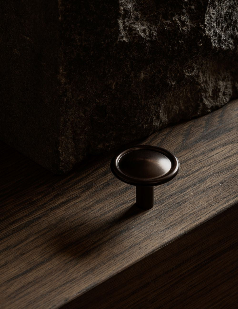 BUTTON knob in burnished brass by BRANDT Copenhagen. A hardware collection in collab with Norm architects consisting of knobs, T-bars and pull bars for kitchens and cabinets.