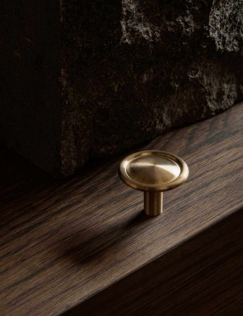 BUTTON knob in satin brass by BRANDT Copenhagen. A hardware collection in collab with Norm architects consisting of knobs, T-bars and pull bars for kitchens and cabinets.