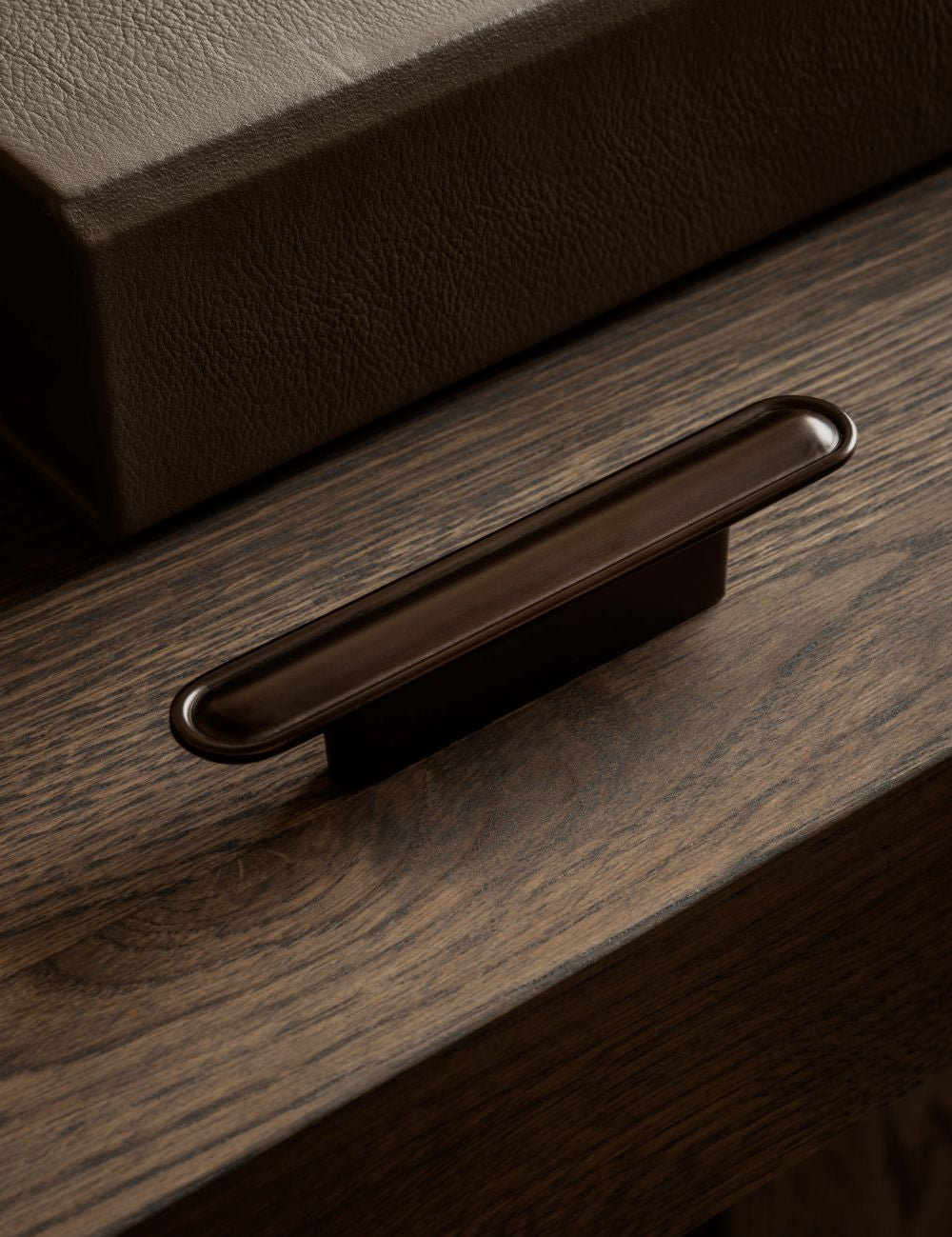 BUTTON pull bar 110 mm in burnished brass by BRANDT Copenhagen. A hardware collection in collab with Norm architects consisting of knobs, T-bars and pull bars for kitchens and cabinets.