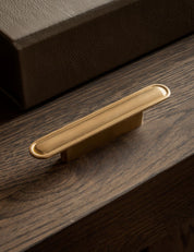 BUTTON pull bar 110 mm by NORM archtiects and BRANDT Copenhagen. Perfect as kitchen handle and cabinet hardware for luxury homes.