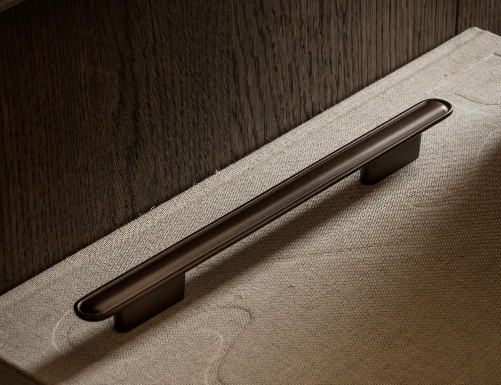 BUTTON pull bar 250 mm in burnished brass by BRANDT Copenhagen. A hardware collection in collab with Norm architects consisting of knobs, T-bars and pull bars for kitchens and cabinets.