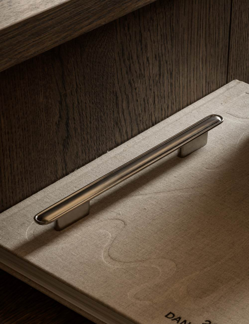 BUTTON pull bar 250 mm satin nickel by BRANDT Copenhagen. A hardware collection in collab with Norm architects consisting of knobs, T-bars and pull bars for kitchens and cabinets.