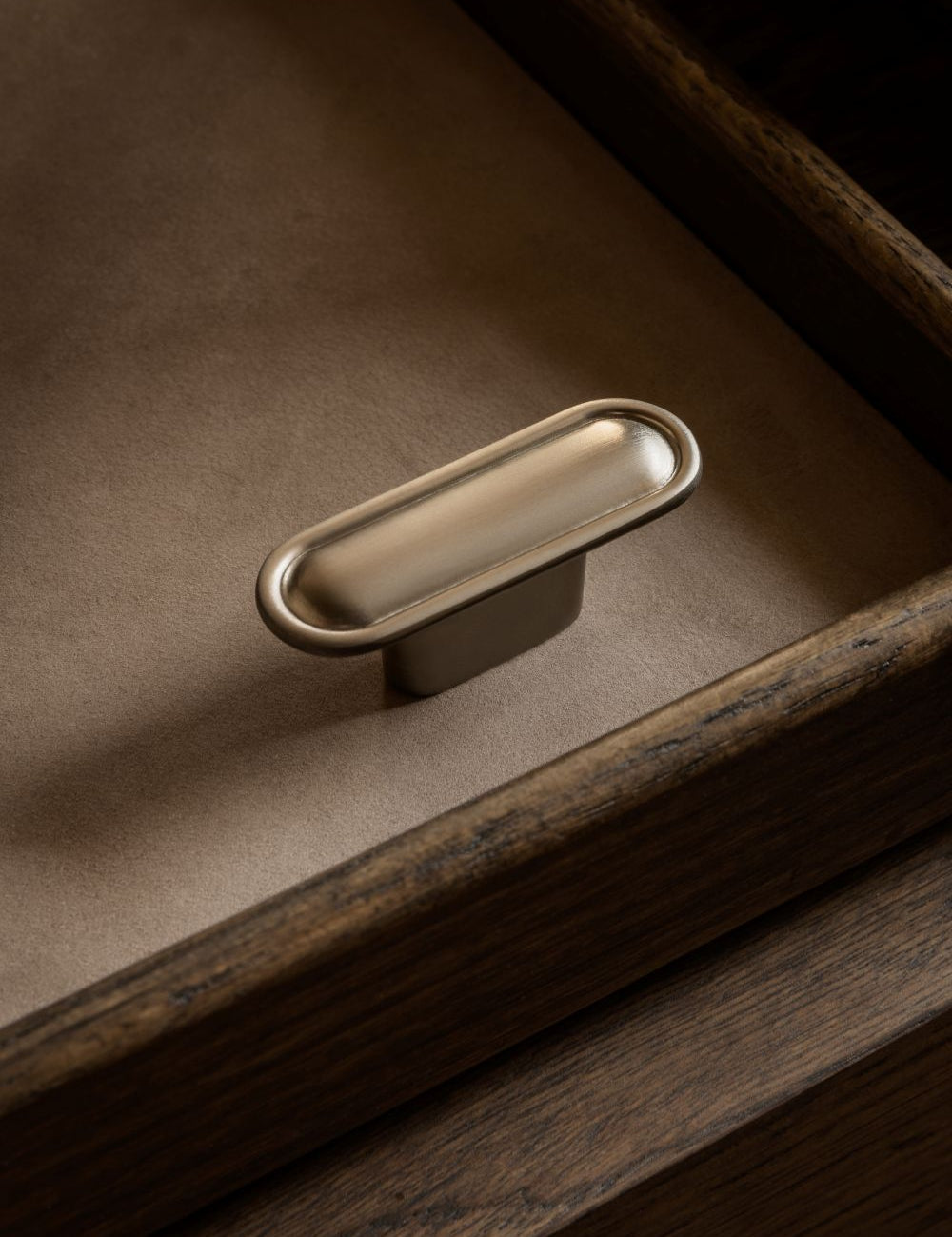 BUTTON T-bar in satin nickel by BRANDT Copenhagen. A hardware collection in collab with Norm architects consisting of knobs, T-bars and pull bars for kitchens and cabinets.