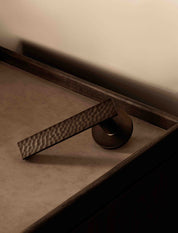 CARVE doorhandle set in Burnished Brass by BRANDT Copenhagen. Designed in collab with Norm architects.