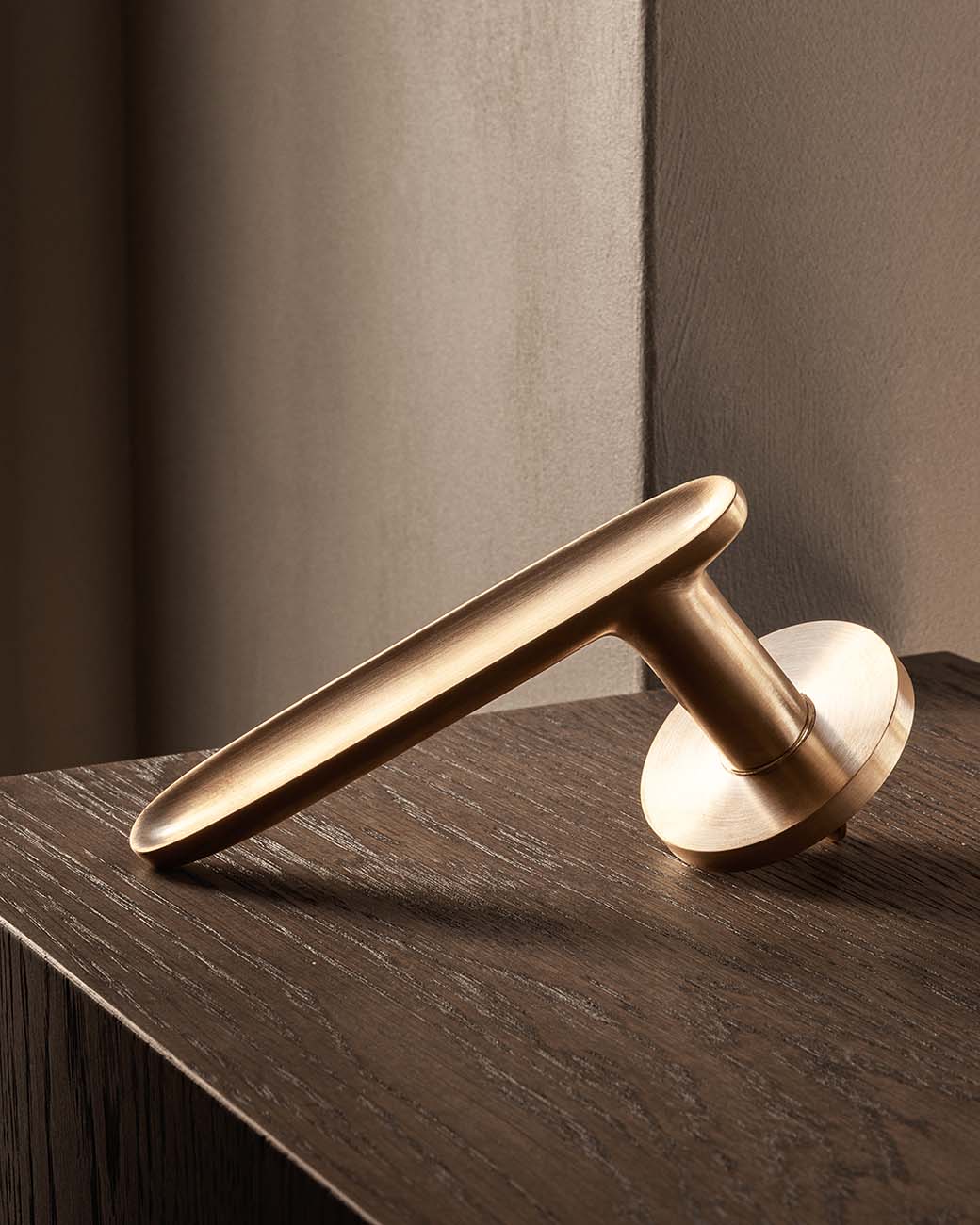 LEAF door lever handle in satin brass by BRANDT Copenhagen. Designed in collab with Norm Architects.