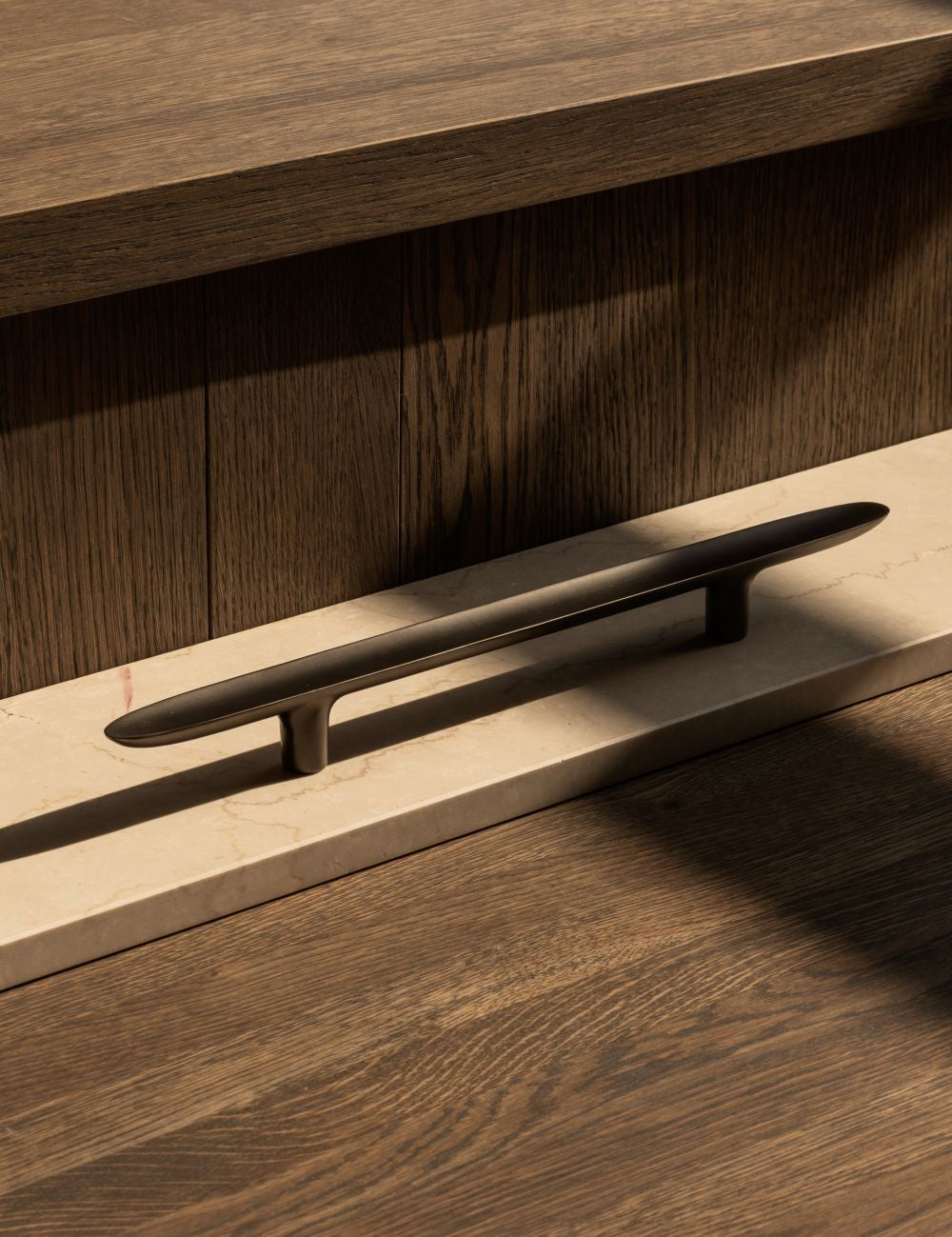 LEAF pull bar 400 mm in Gunmetal black by BRANDT Copenhagen and Norm architects. Kitchen handle in solid brass - ideal as appliance pull.